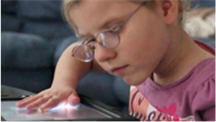 Young girl with touchpad.